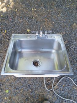 Stainless still sink with faucet