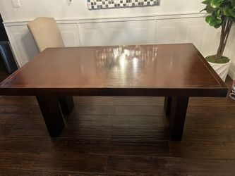 Dinning Table And Upholstered Beige Chair