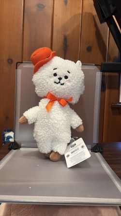 Defected BK7552 14” BT21 RJ standing plush doll dressed in a signature orange hat and bow tie.