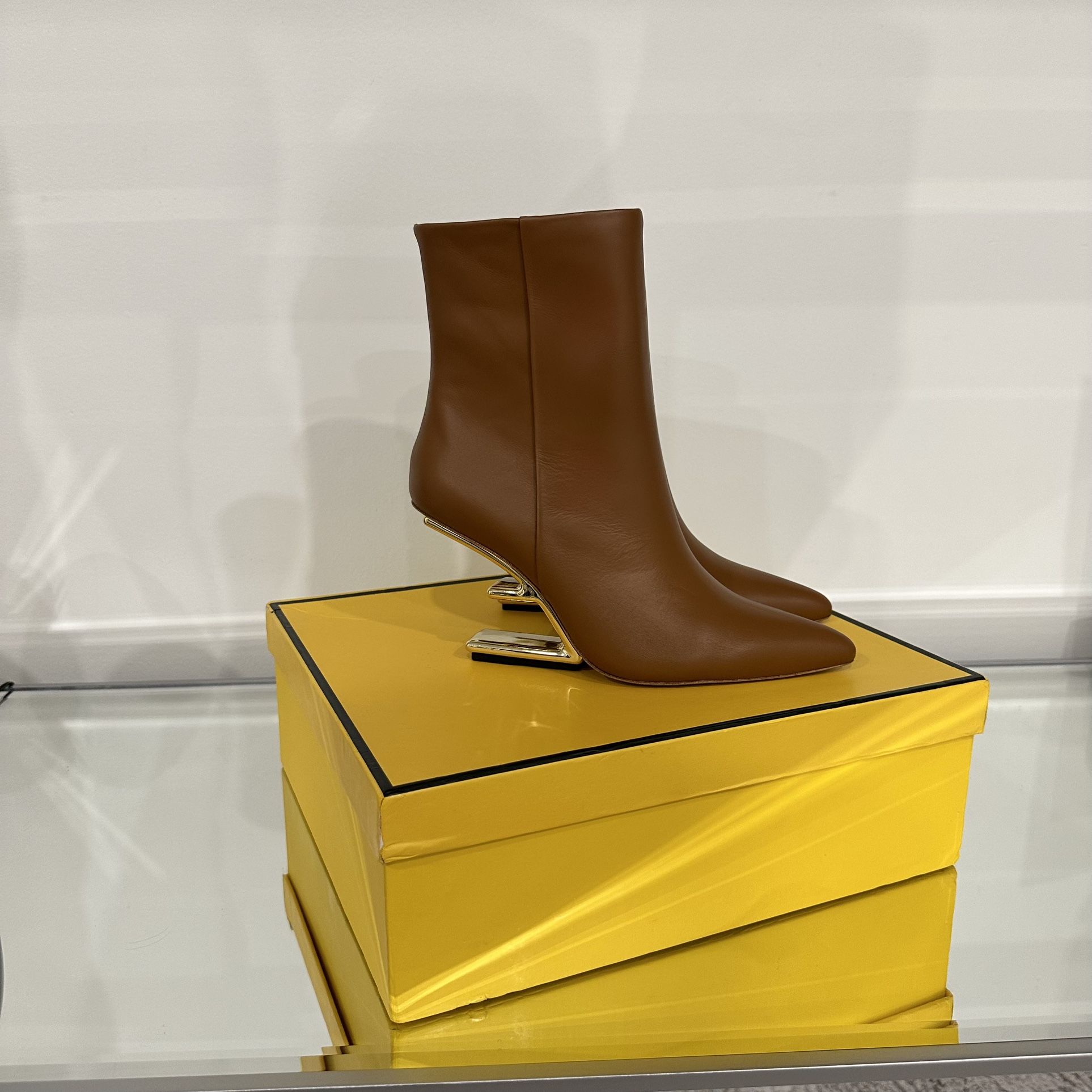 NEW SEASON FENDI FIRST F-SHAPED HEEL ANKLE BOOTS for Sale in  Fendi First/type Leather Ankle Boot with Sculpted Gold Heel. main image 0