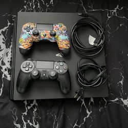 PS4 pro with two dual shock controllers
