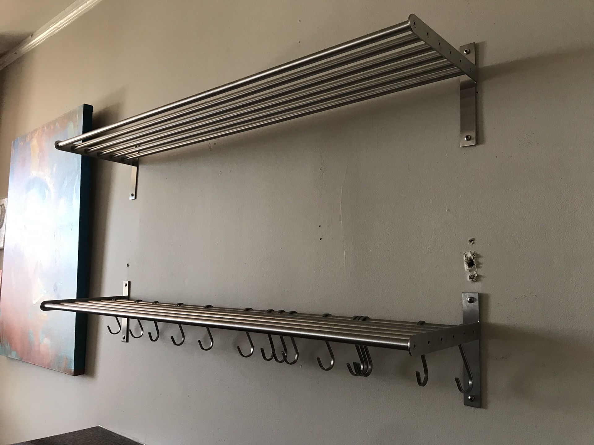 Two ikea grundtal metal kitchen shelves with hooks