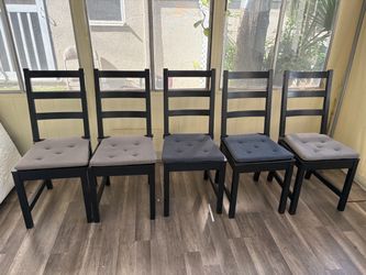 Five chairs with cushions