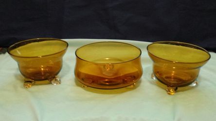 vintage amber glassware, with clear glass feet.