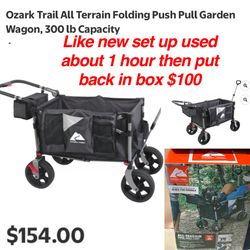 Like new set up used 1 hour and put back in box Ozark Trail All Terrain Folding Push Pull Garden Wagon, 300 lb Capacity