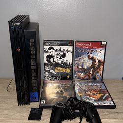 PlayStation 2 console with four games