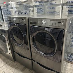 Kenmore elite stainless steel Frontload washer and dryer set electric used