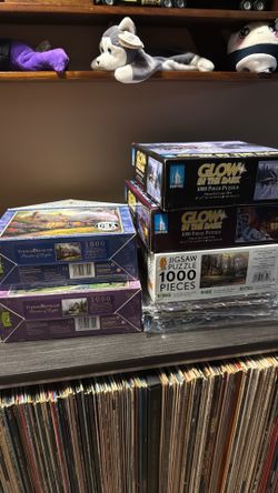 Jigsaw puzzles.  1000 pieces.   Kinkaid
