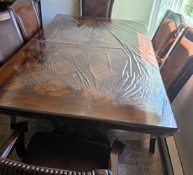 Big table, color brown and six chairs