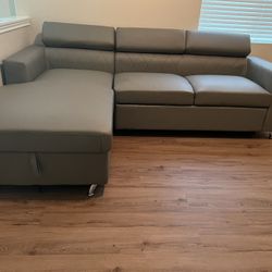 New Sectional W Adjustable Headrests.  Grey, Orange Or Black Leather Match.  110x68X29H.  Free Delivery!