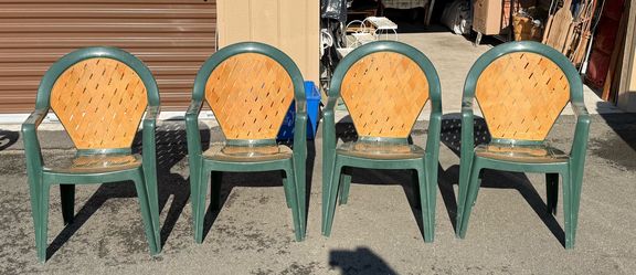 (4) Grosfillex Amazona Green Outdoor Resin Stacking Chairs.