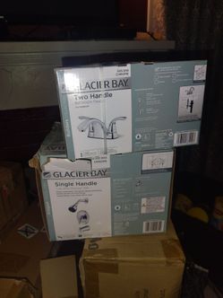 Sink, handles, vanity lights, fan, kitchen cabinet, toilet