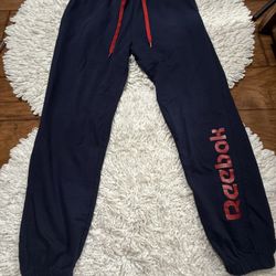 Reebok Core Knit Sweat Pants in a dark blue (maritime blue/navy) color with a red drawstring and logo Medium