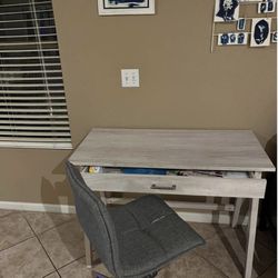 Small wooden desk with I large drawer and chair in wheels. Perfect for bedroom, den, or small space. 