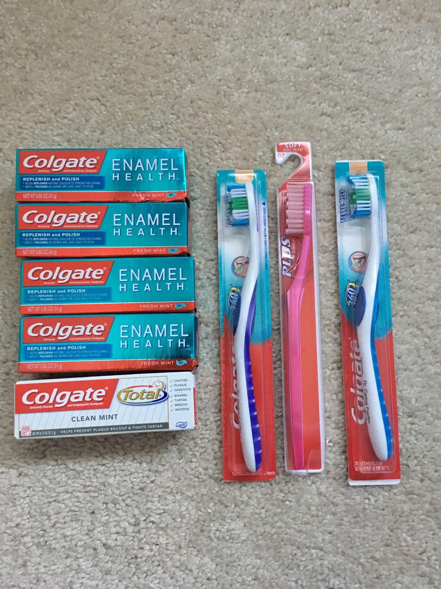 3 new toothbrushes and Colgate toothpaste