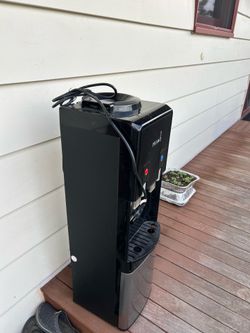 Primo Top-Loading Water Dispenser in black and stainless steel.