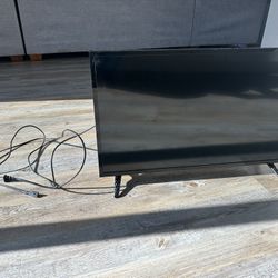 two 27-33 inch tv