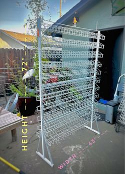Used white metal wire floor-standing retail display rack can be used for small craft items.