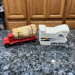 Ceramic Oregon State Souvenir shape and log truck pair of  Salt and Pepper Shakers.  Preowned never used with cork stoppers.  Some minor pair wearing 