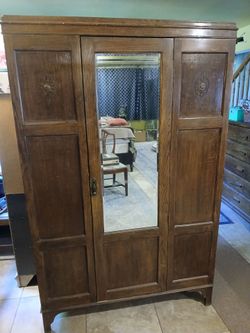 Armoire with dressing mirror