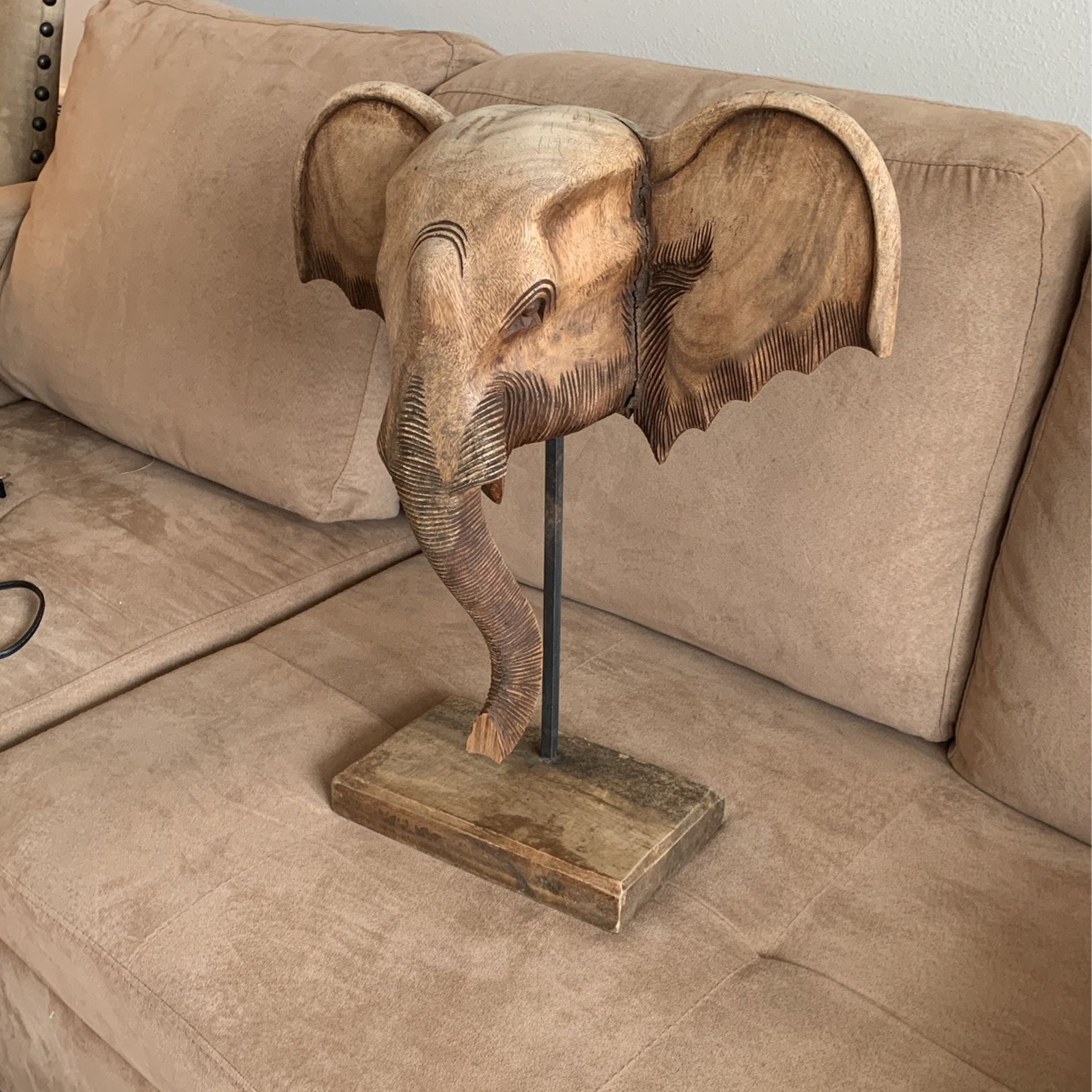 Solid wood carved elephant wood base.