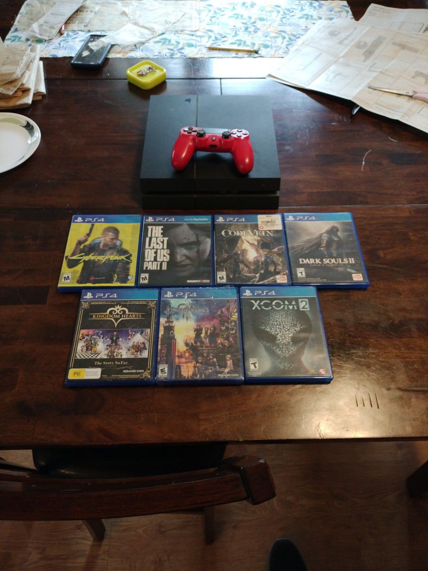 PS4 with Controller and Games