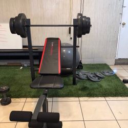 Gym Equipmentt bench press with 100lb weight set