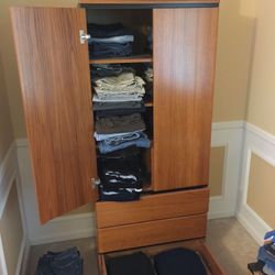 Mid-Modern heavy (thick solid) teak armoire.