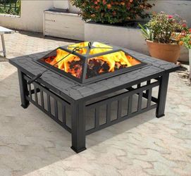 New in a box, 32" Versatile Outdoor Fire Pit For Gardens And Backyards Perfect For Cozy Gatherings.