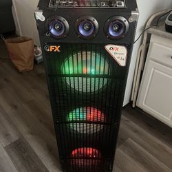  QFX  it has 3  speakers  with microphone and remote control it has   Bluetooth  USB FM radio and SD it has LED party Lights Sounds Great