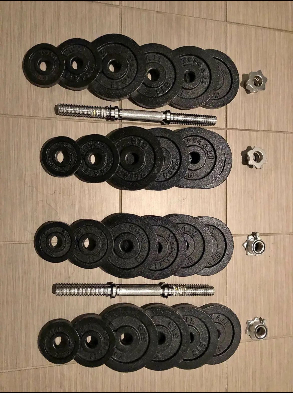 Pair Of Adjustable Weight Dumbbells