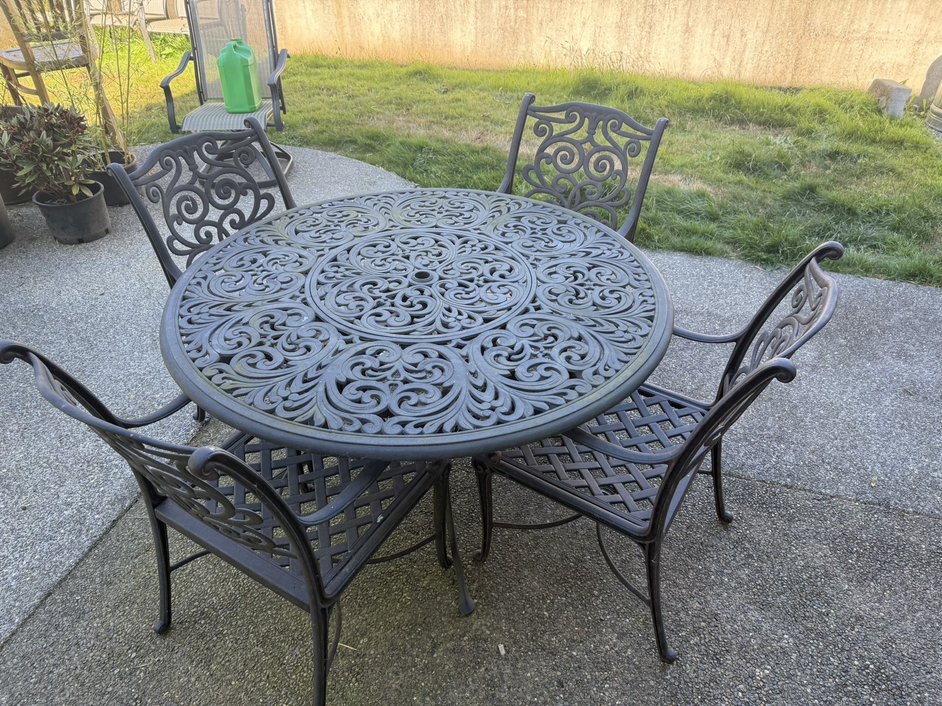Cast Iron Table and 4 Chairs.
