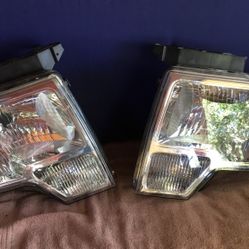 2009 - 2014 Ford F150 Pair of factory Headlights.  
