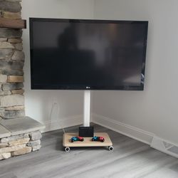 New TV stand with outlets, rolling, swivel, minimalistic design

