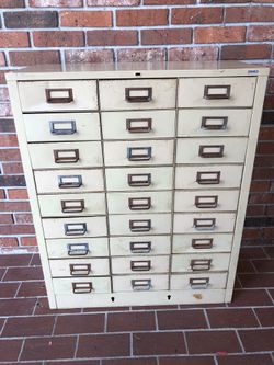 Vintage 27 drawer cabinet by Cole (31”x13”x38”)