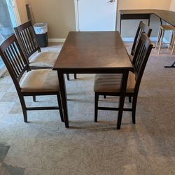 Dining room table set with four chairs