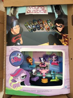 Mc Donalds happy meal toys - Young Justice Skate Board and Littlest Pet Shop.