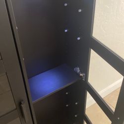 Black Cabinets With Lights And Glass Shelf’s 