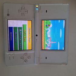 Nintendo DSi with charger and pen