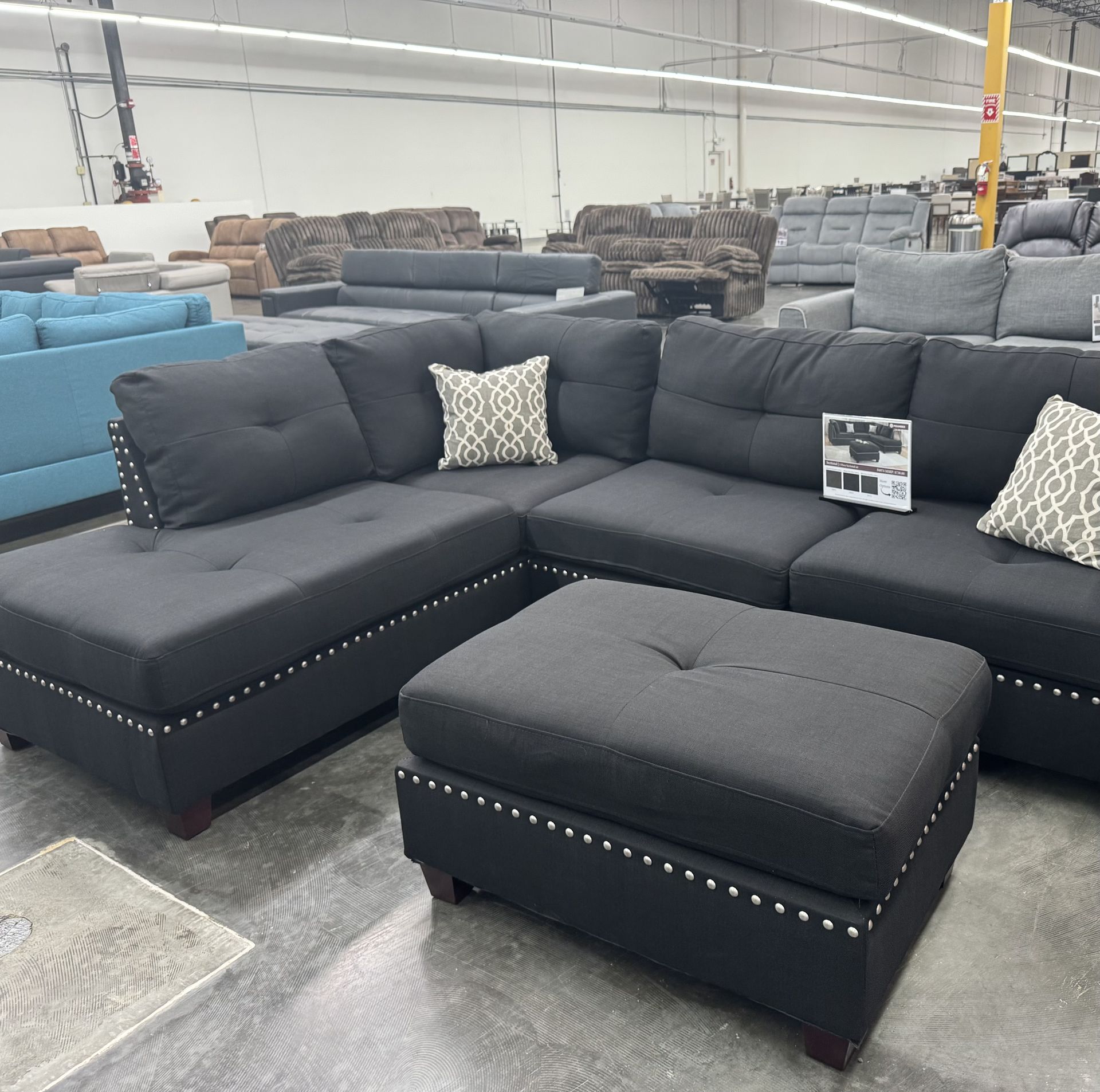 BLACK SECTIONAL SOFA WITH OTTOMAN. REVERSIBLE CHAISE. WE DELIVER