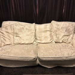 Classic Cream Colored Sofa With 4 Decorative Pillows