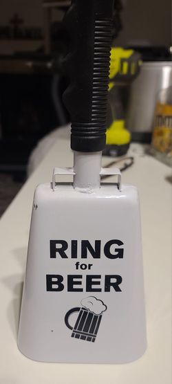 Ring for Beer Cowbell. Made of metal with a white finish and a black handle
