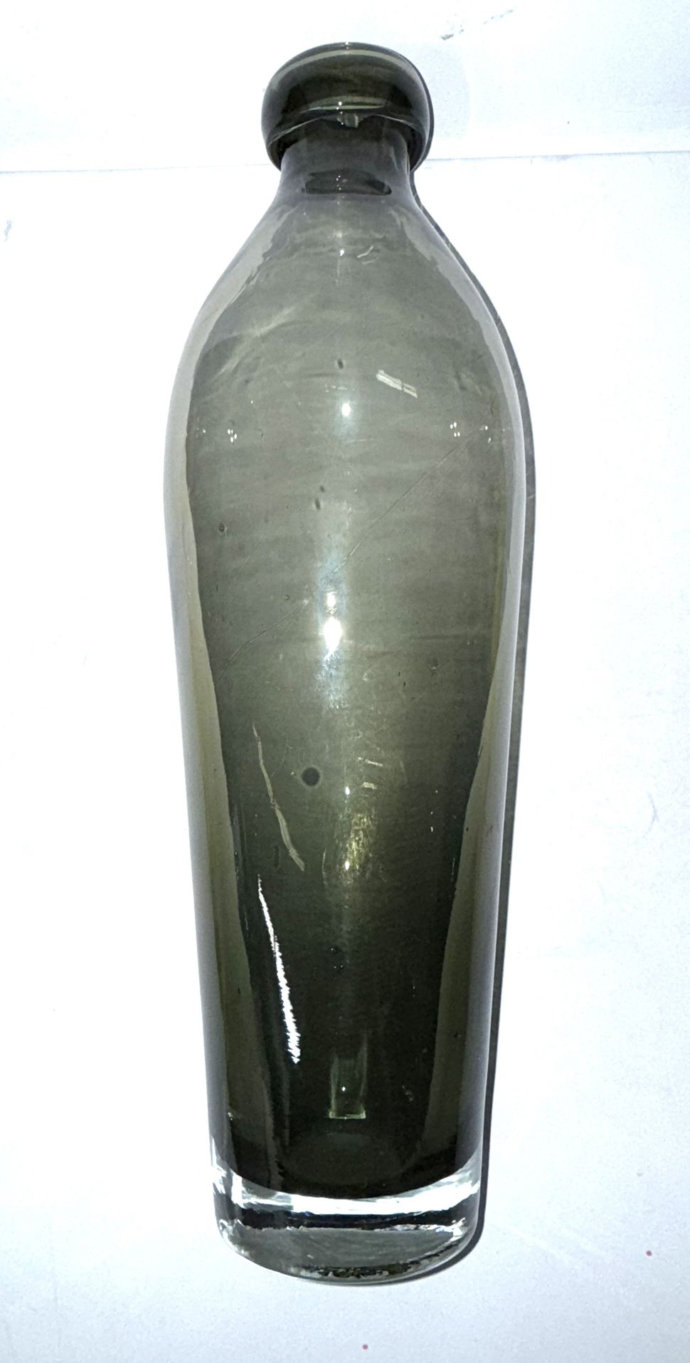 Vintage Art Glass Decanter stands at 15 inches tall, showcasing a sleek smoke grey color that fits perfectly with its Mid-Century Modern style.
