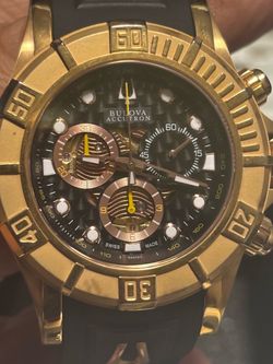 Bulova Accutron chronograph, likely model 64A101, featuring a rose gold-toned stainless steel case and a black rubber strap.