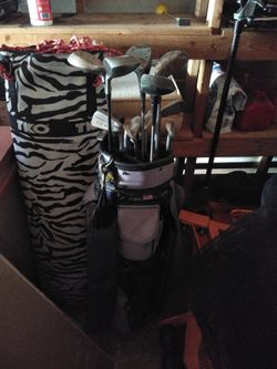 Punching bag and set of clubs w/bag