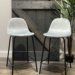 {TWO} 23.5” Kody Counter Stools. Platinum velvet style and black metal bases. SMALL PROFILE SEATS! MSRP $200. Our price $95 + sales tax  