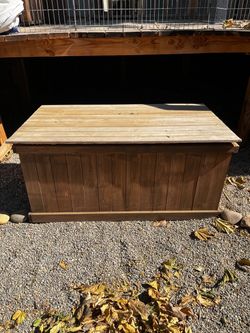 Wooden storage box used by pool