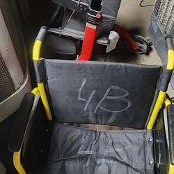 An assortment of wheelchairs with foot rest, and walkers. Big and small for sale.