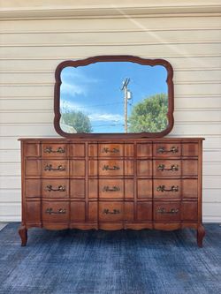Vintage 1940s solid cherry 12-drawer serpentine French Provincial triple dresser and matching mirror