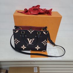 Louis Vuitton onthego pm bag. Bicolor monogram empreinte leather. 